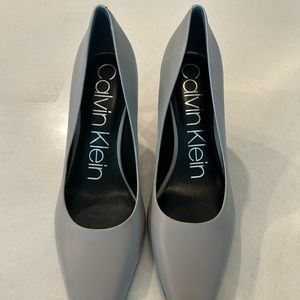 Light gray Calvin Klein pumps.  Never worn, perfect condition